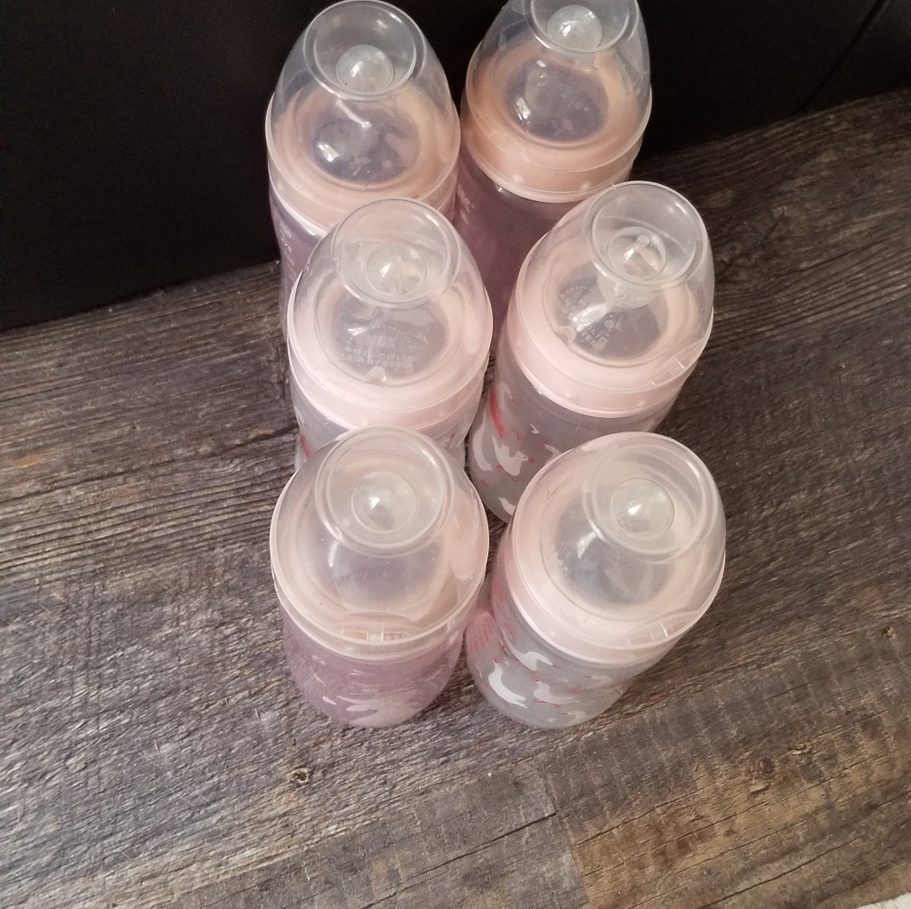 6 10 oz tall NUK bottles